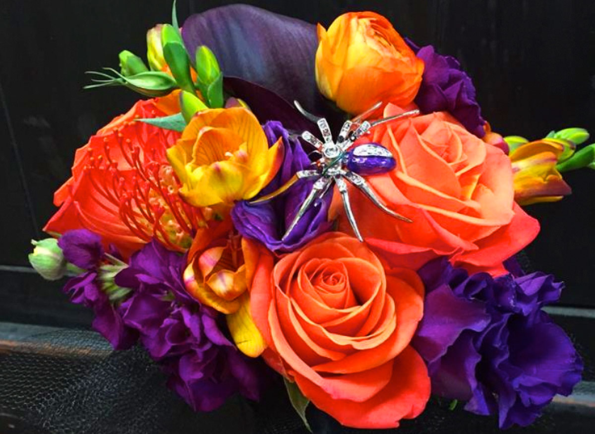 A vibrant orange, purple and yellow bouquet